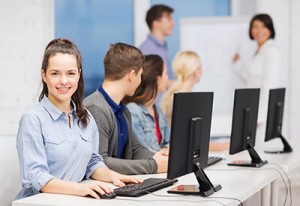 students with computer monitor at school